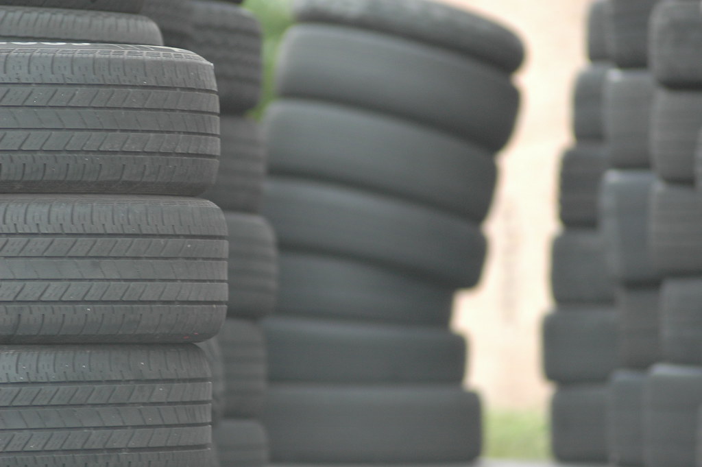 Tall stacks of scrap passenger tires waiting for collection